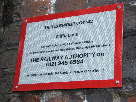 Bridge sign on WCML, near Acton Bridge Station